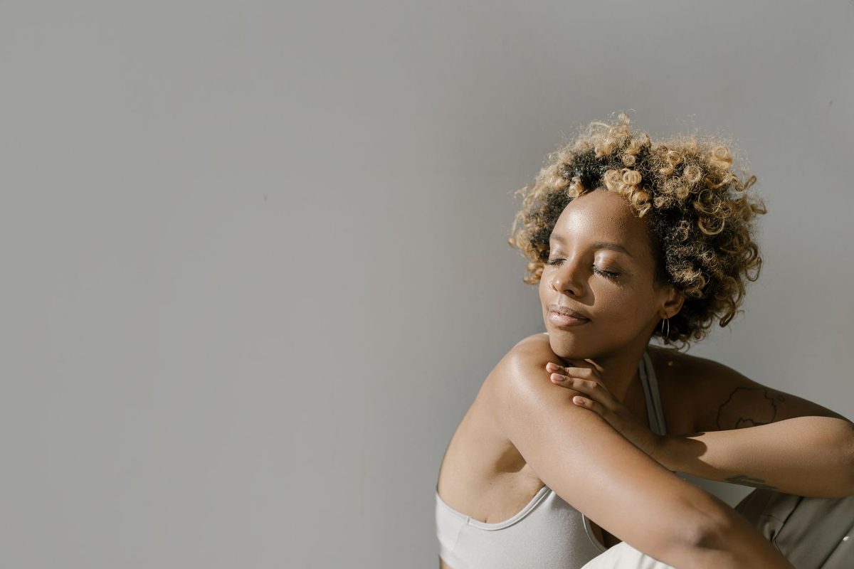 A woman relaxing in soft sunlight